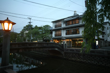 View of the main building along the river (at dusk)