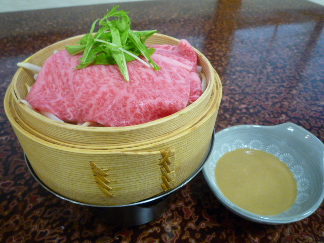 Hida beef steamed in a bamboo steamer