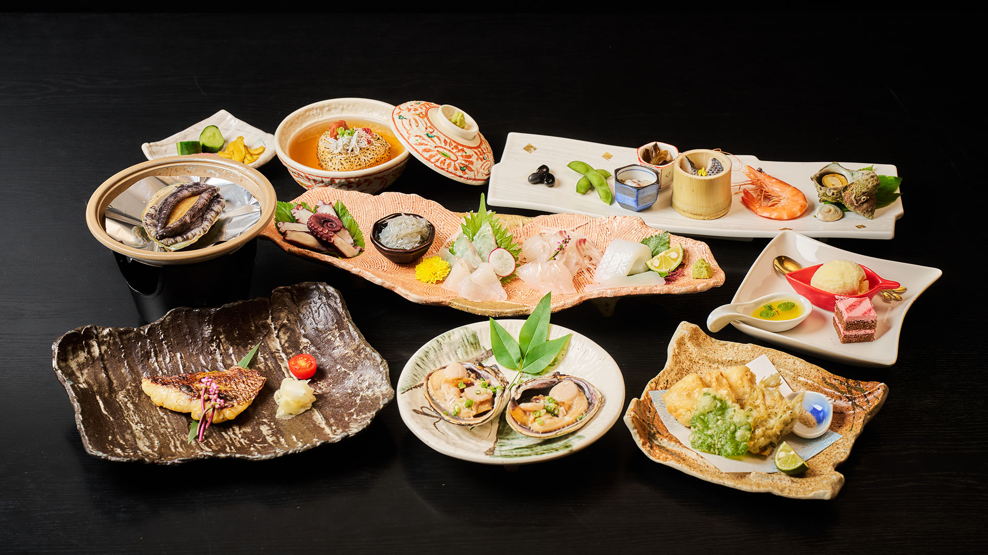 ・【スタンダード夕食一例】多様な料理で旬の海鮮をお楽しみいただける、スタンダードな夕食です