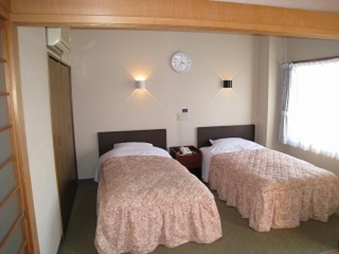 和洋室のベッドのある部屋