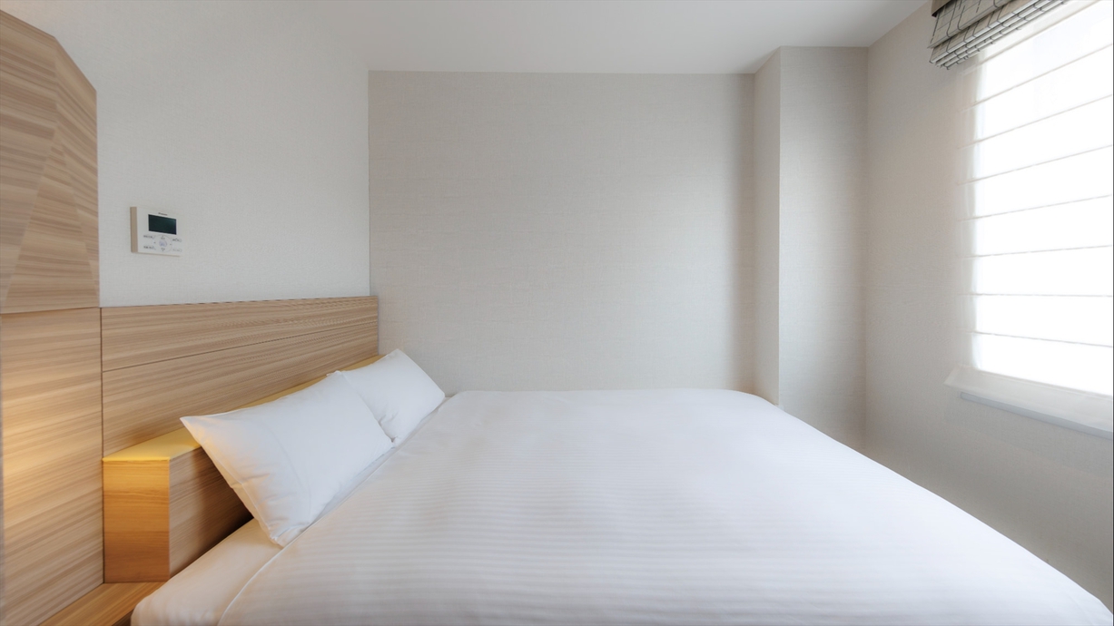 【スタンダードダブル（南館）15㎡】「コーラルグリーン」がアクセントの明るく洗練された空間 