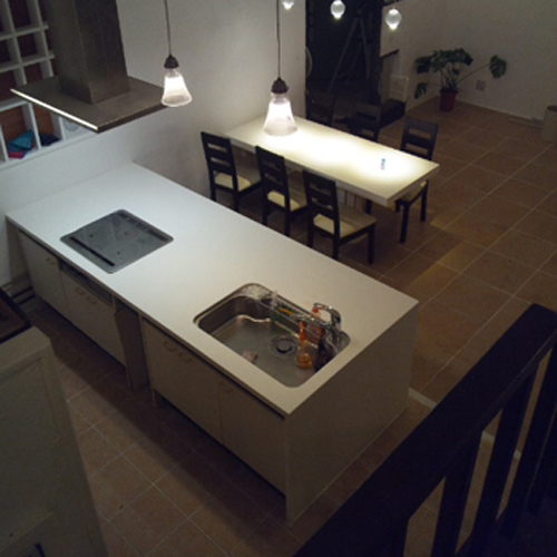 An island-type system kitchen and table.