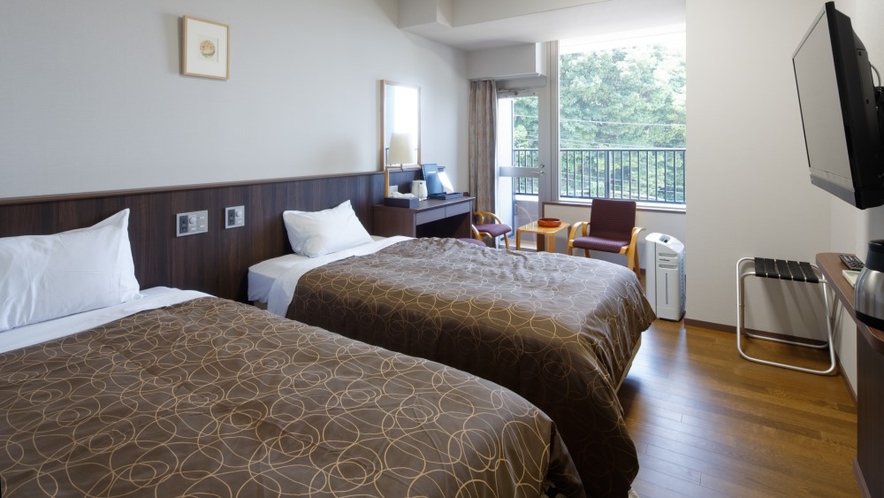 【洋室ツインルーム】ベッドは全室「ブレスエアー」を採用、腰が沈まない特殊な硬さで上質な寝心地を