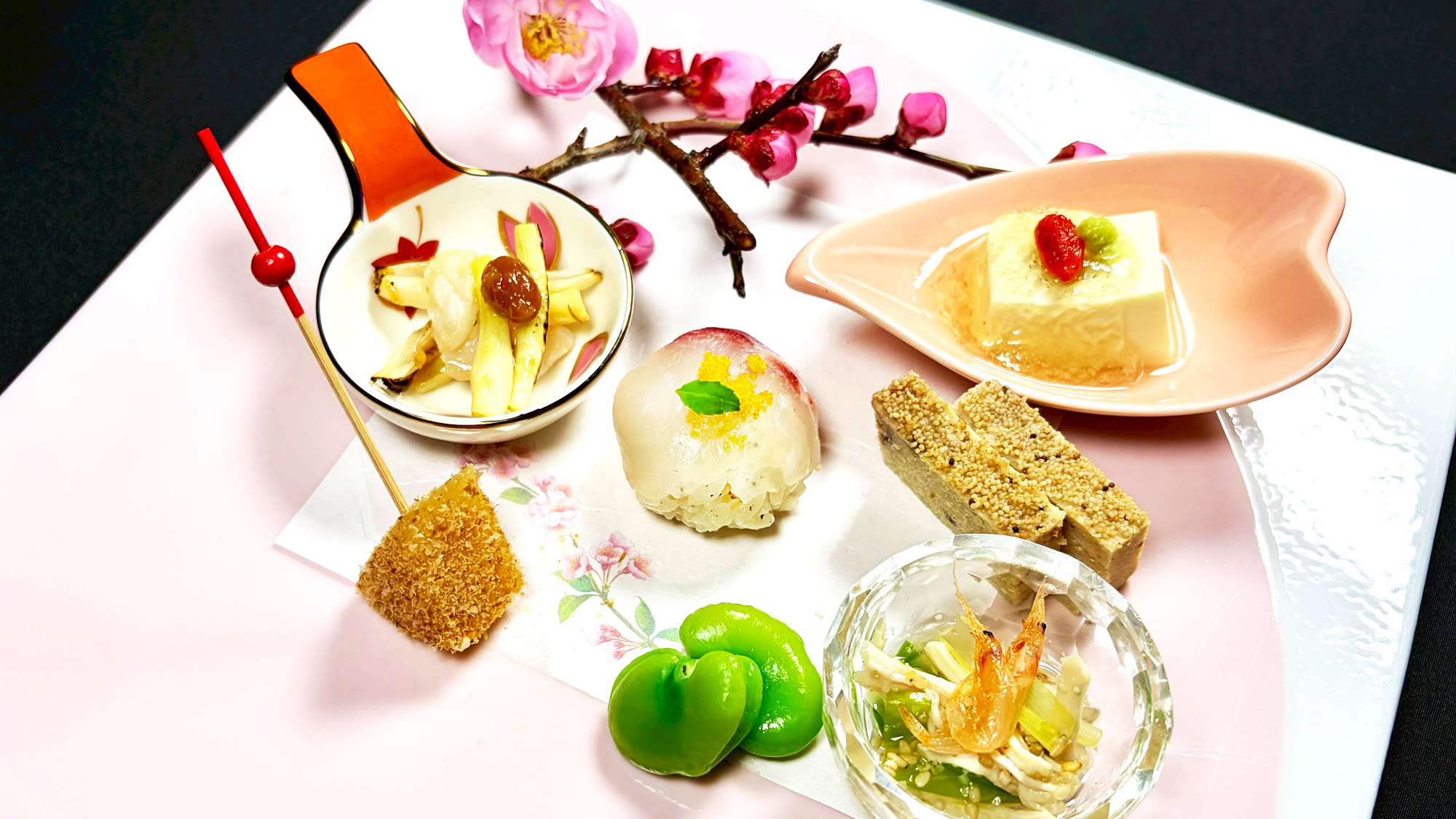 前菜一例：新緑豆腐、桜鯛手毬寿司、鶏松風、島らっきょうもろみ和え、空豆艶煮、さつま町産筍土佐まぶし他