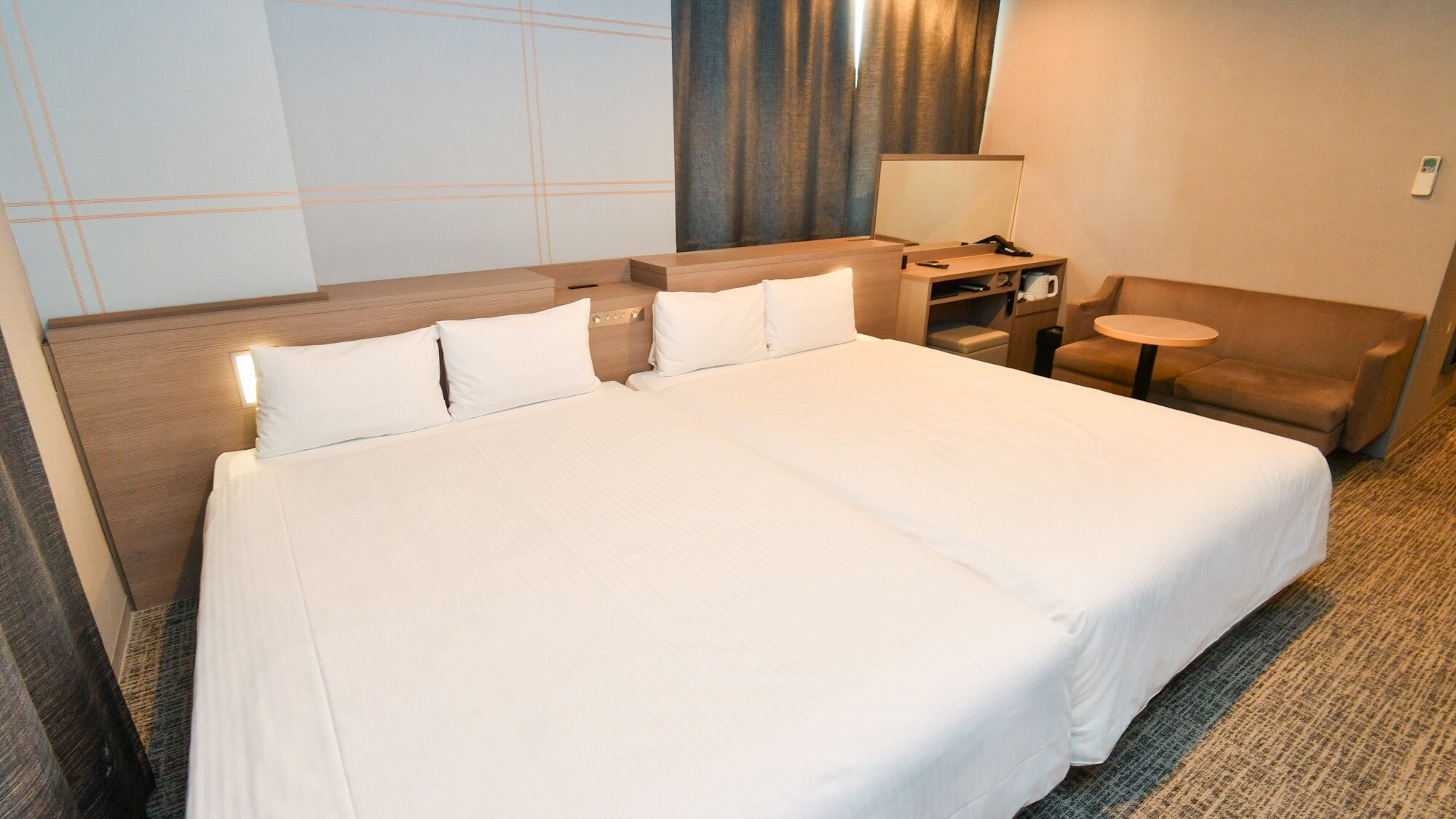 デラックスツインルーム | ベッドがくっついているので、小さなお子様も安心してご宿泊いただけます