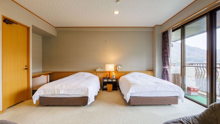 【ファミリールーム】寝室は大きめのベッドでゆったりと。