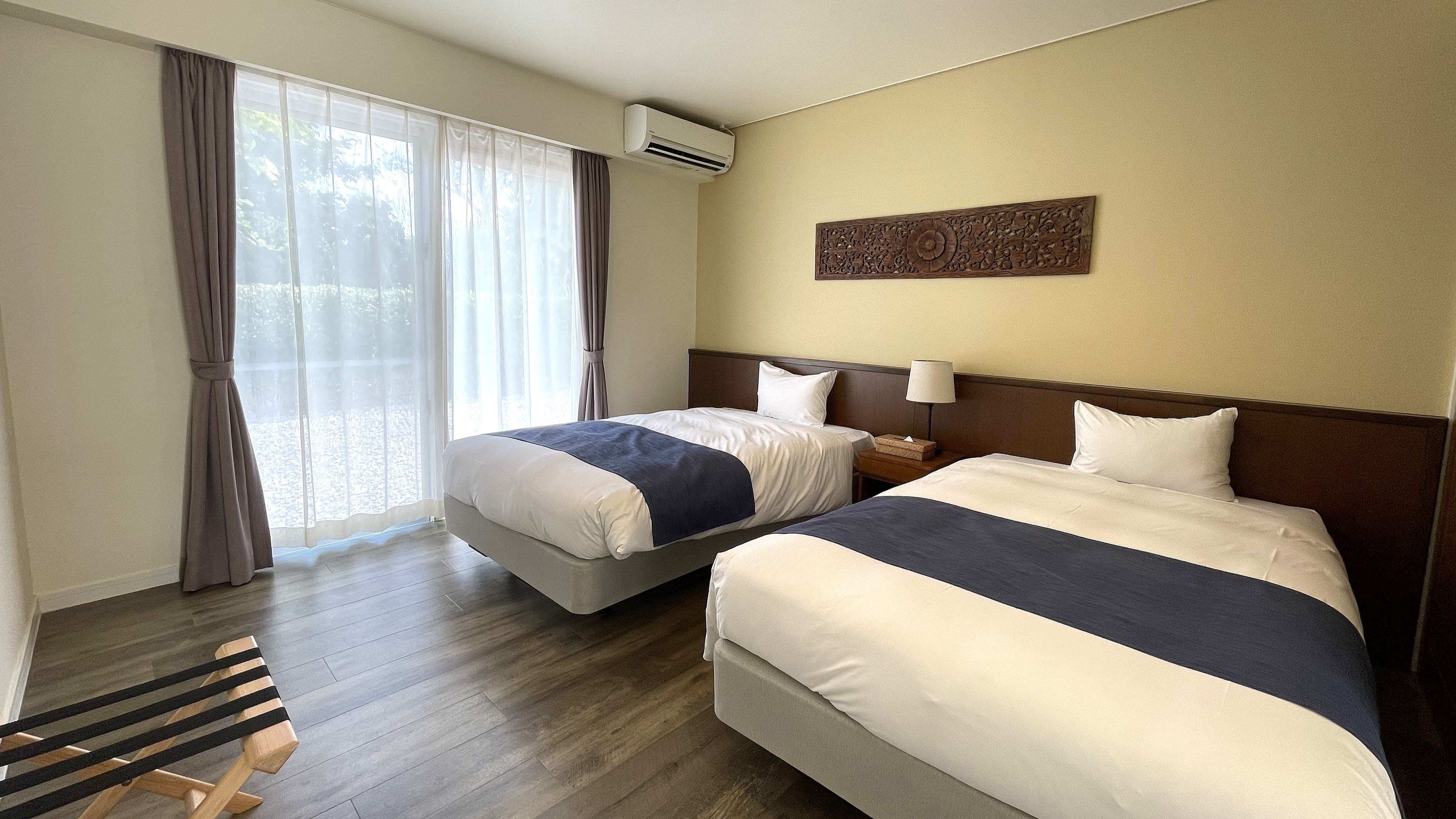 【ORCHID：ベッドルーム】落ち着いた雰囲気の寝室。ゆったりとした空間で旅の疲れを癒します。