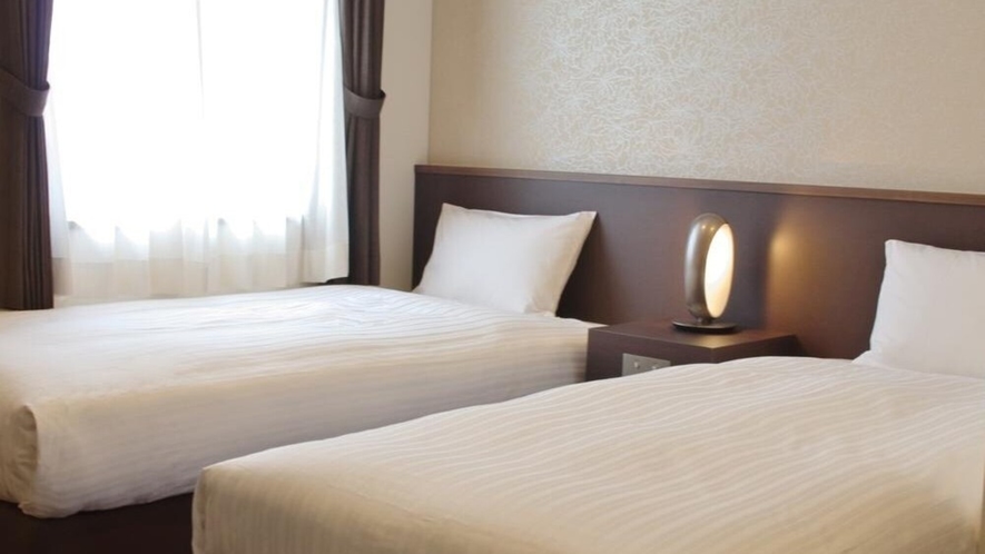 【ツインルーム】ベッドは国内一流ホテルでも愛用されている日本ベッドを利用。