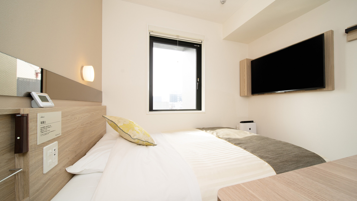 広々としたベッドでごゆっくりおくつろぎ頂けます