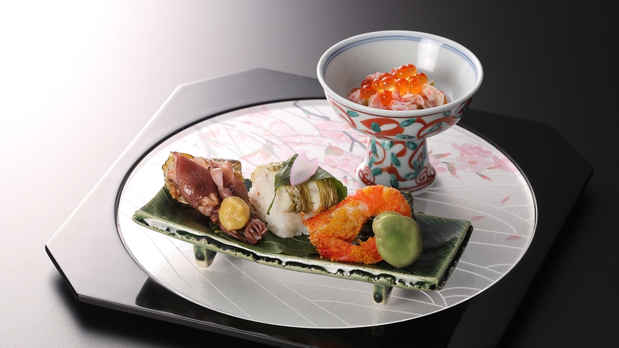 春の料理一例：先付け紅蟹、葉山葵、いくら、鰆桜花寿司、蛍烏賊、蓬胡麻豆腐