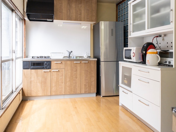 Spacious kitchen with kitchen appliances.