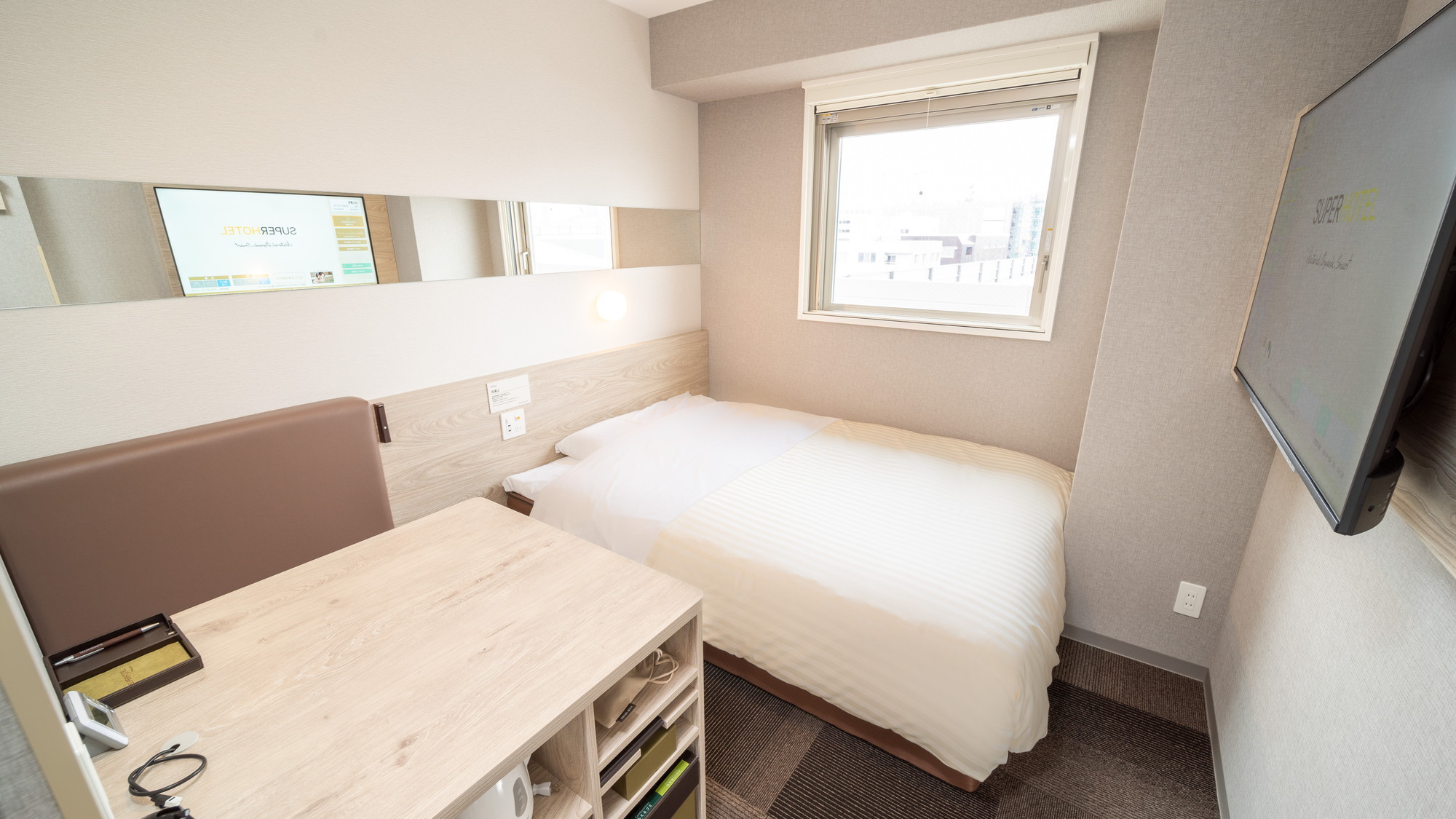 広々としたベッドでごゆっくりおくつろぎ頂けます