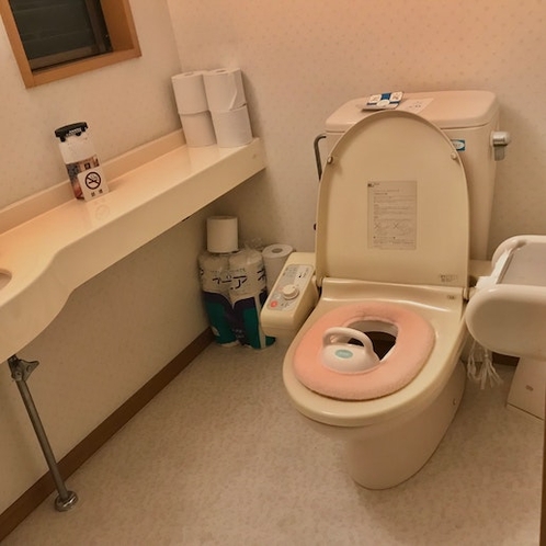 Toilet with a baby seat
