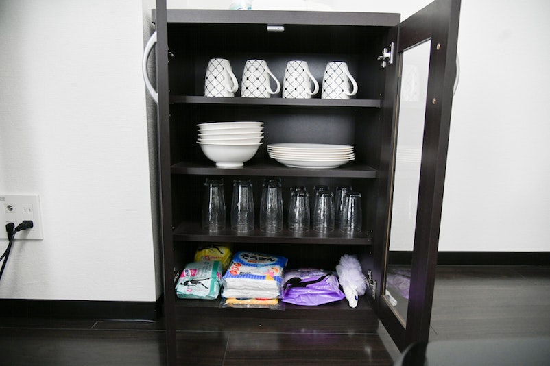 Cups, plates and cleaning tools are in the shelf! 