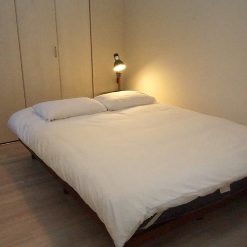 A cozy double bed for 2 awaits. There's a large...