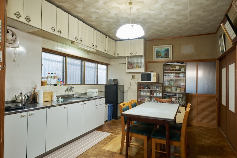 The kitchen.  microwave, a toaster and a rice cook