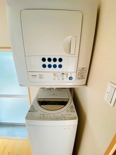 There is a washing machine and a dryer in the...