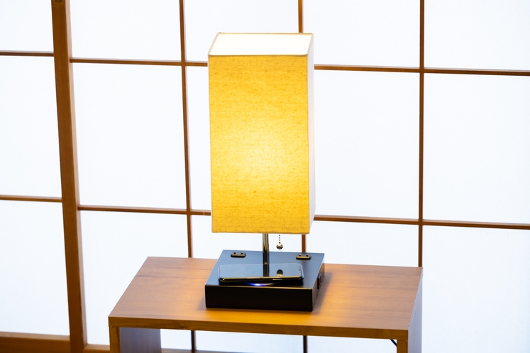 Lamp with outlet