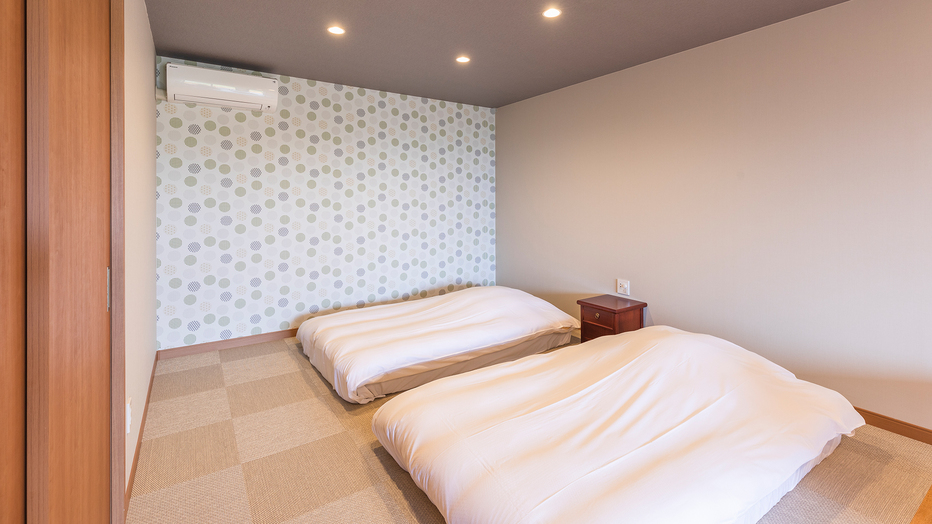 ［106号室］畳にお布団を敷いたベッドルーム