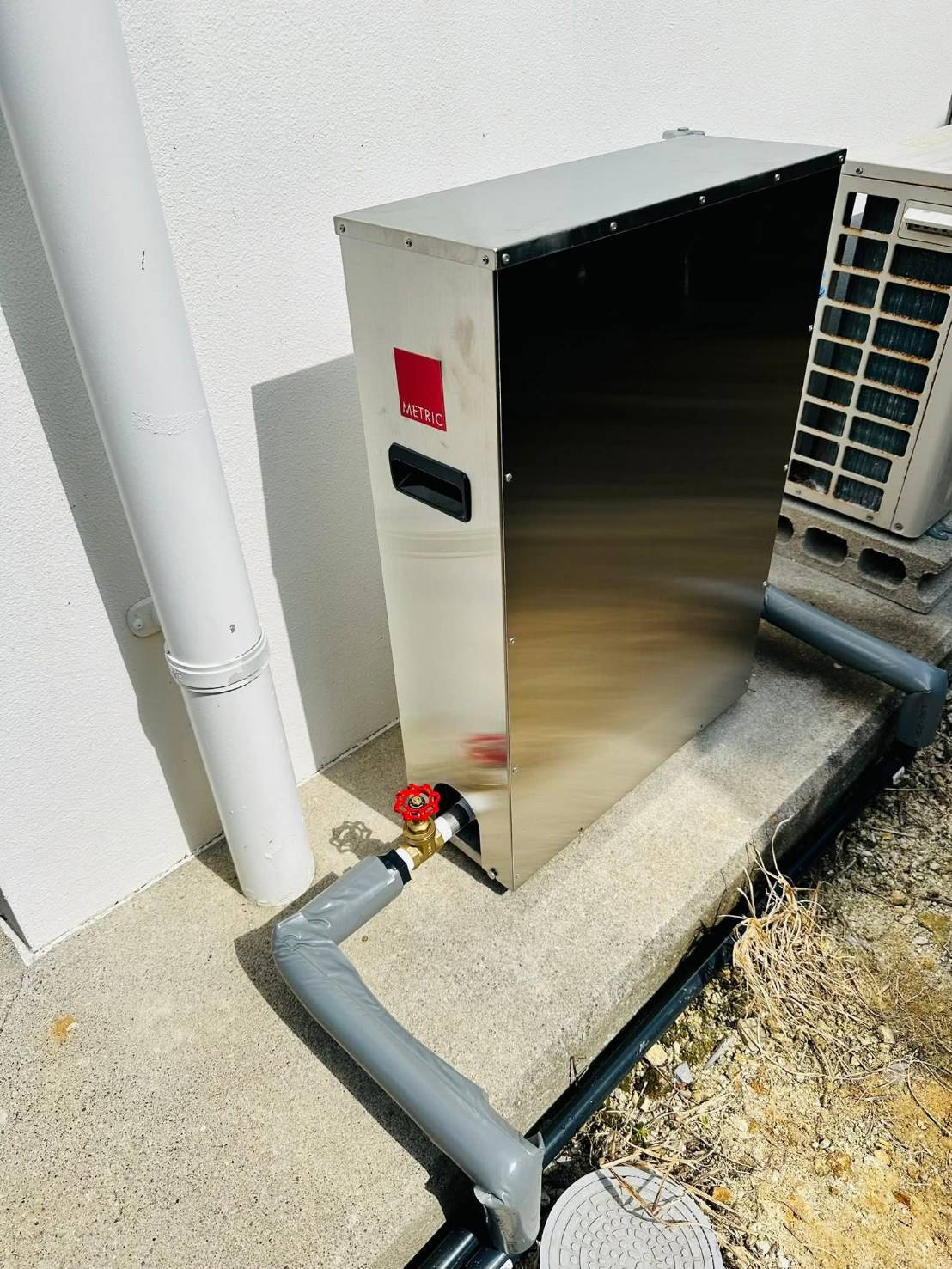 メトリック水の装置