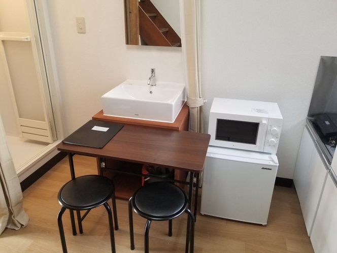 Desk, microwave range, fridge