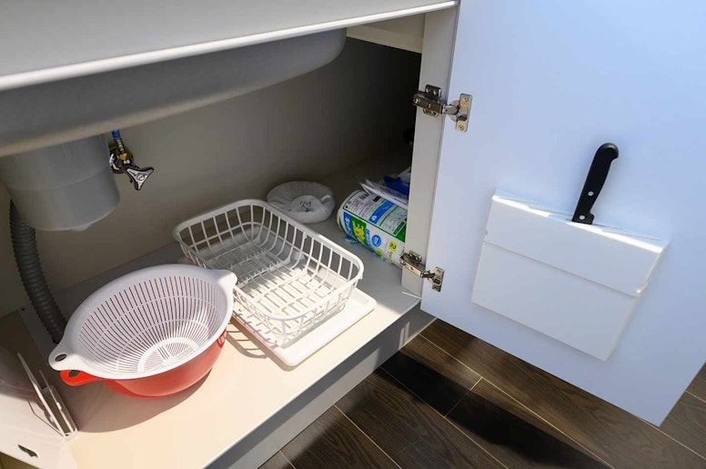 Colander, dish detergent, sponge, paper towel...