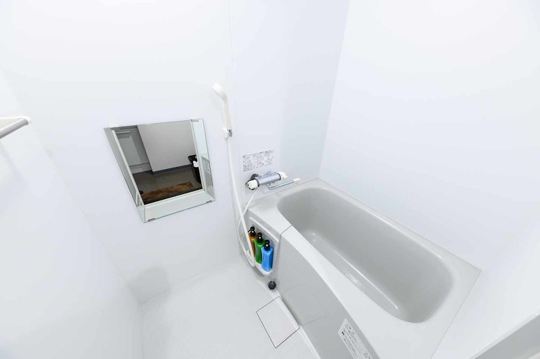Comfortable bathroom! There is a bath tub and a...