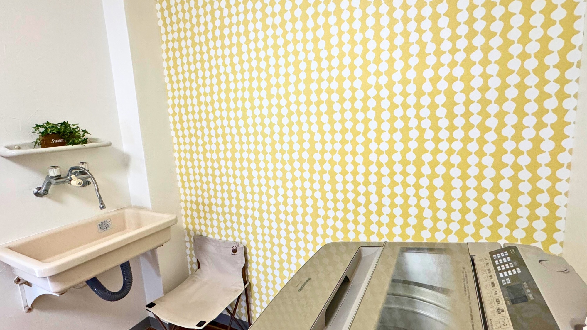 洗面台と洗濯機がある洗面スペース