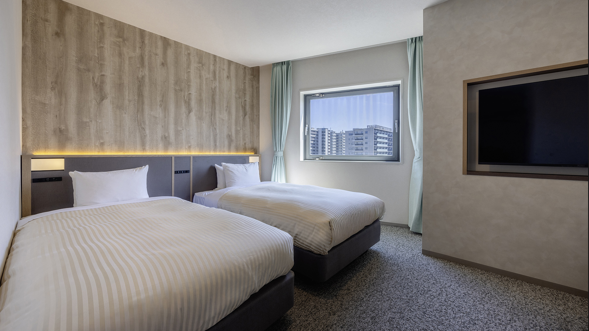 【DXツイン】27平米/シングルベッド（110cm幅）2台を配した空間。