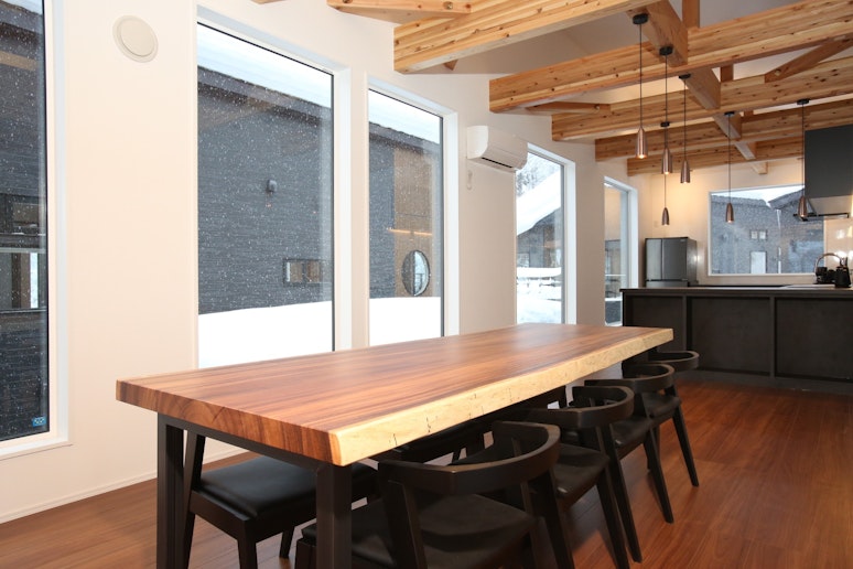 Dining room with a large natural wood dining table