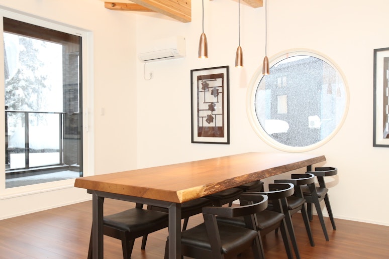 Dining room with a large natural wood dining table