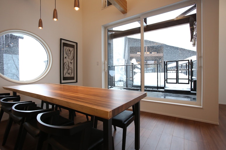 Dining room with a large natural wood dining table