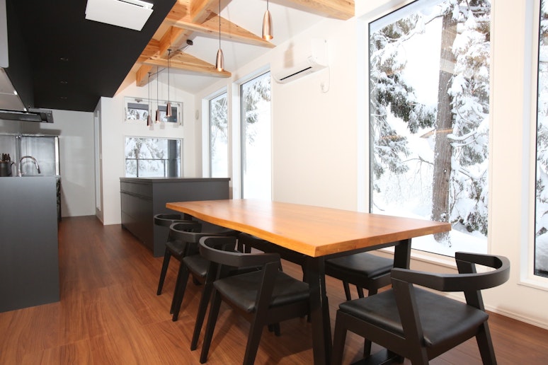 Dining room with a large natural wood dining table