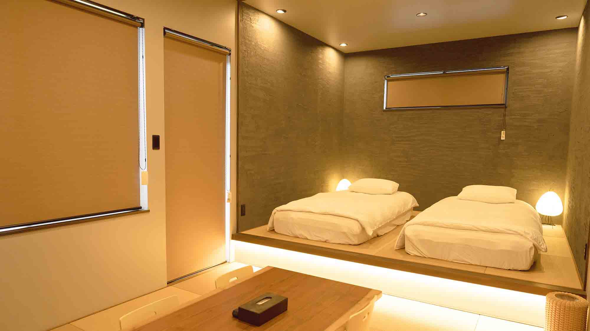 ・【C棟】琉球畳のリビングに小上がりのベッドエリア　ご自宅のようにゆったりとお寛ぎください