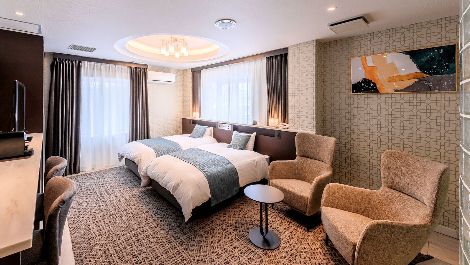 【デラックス】シモンズ製ツインベッドで快適空間。※写真は上位客室の一例です。