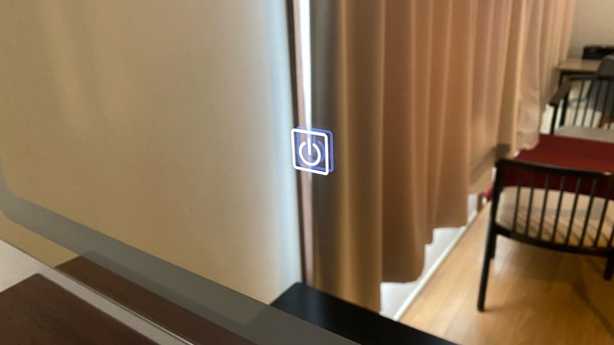 湯治館5階リニューアル和室の洗面所：このマークを指で押すとライトが点灯します。