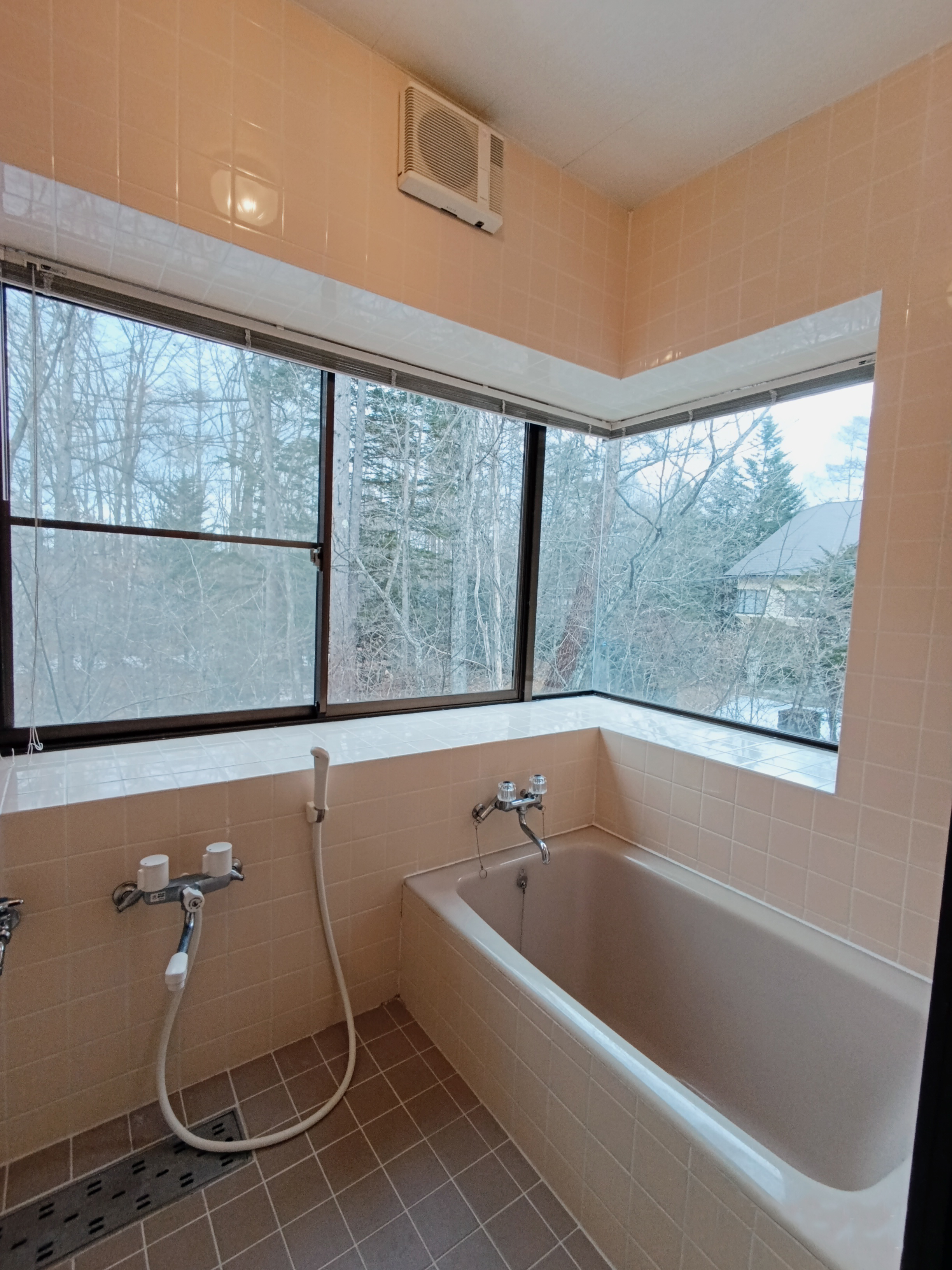 Enjoy a relaxing bath with a beautiful forest view through large windows. A peaceful and refreshing space to unwind after a day of exploring.