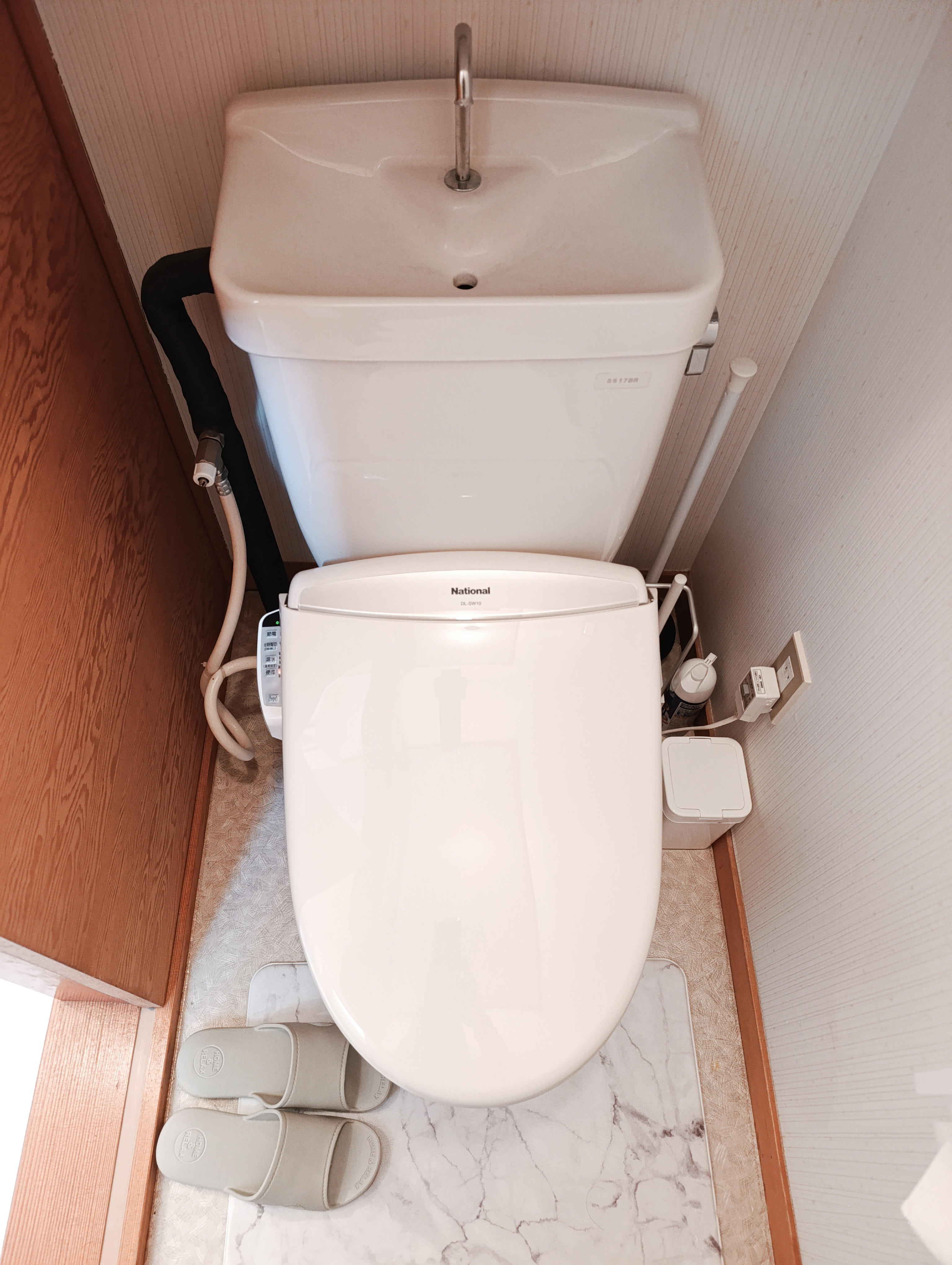 Clean and well-maintained Japanese toilet with bidet function, providing comfort and convenience during your stay.