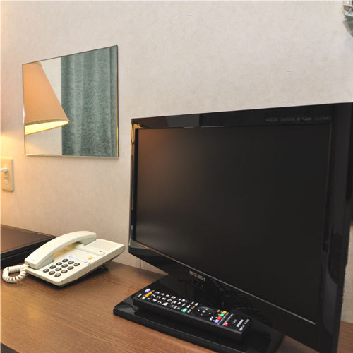 The flat-screen TV makes your room refreshing!
