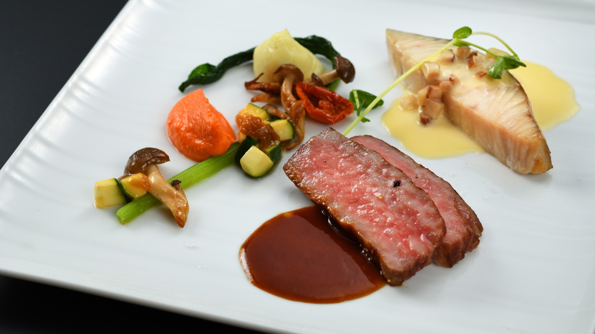 2026プリンスディナー「国産牛肉とお魚のパナシェ　深浦人参入りジュドブッフといぶりがっこのバターソ