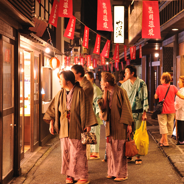 Customers walking around the hot spring town