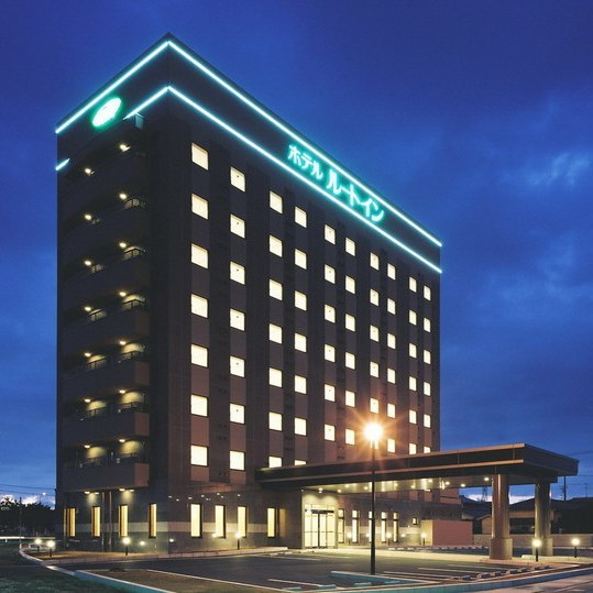 "Exterior of the hotel (night)"