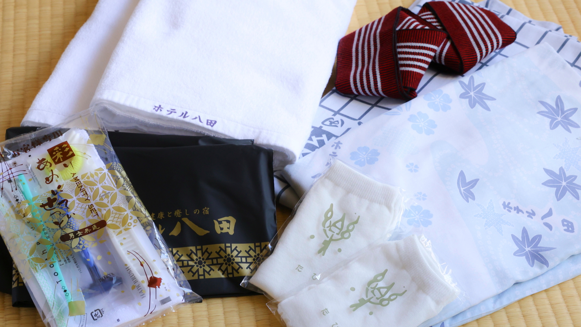客室アメニティ（一例）ロゴ入り手提げ袋の中にアメニティセットが入っております