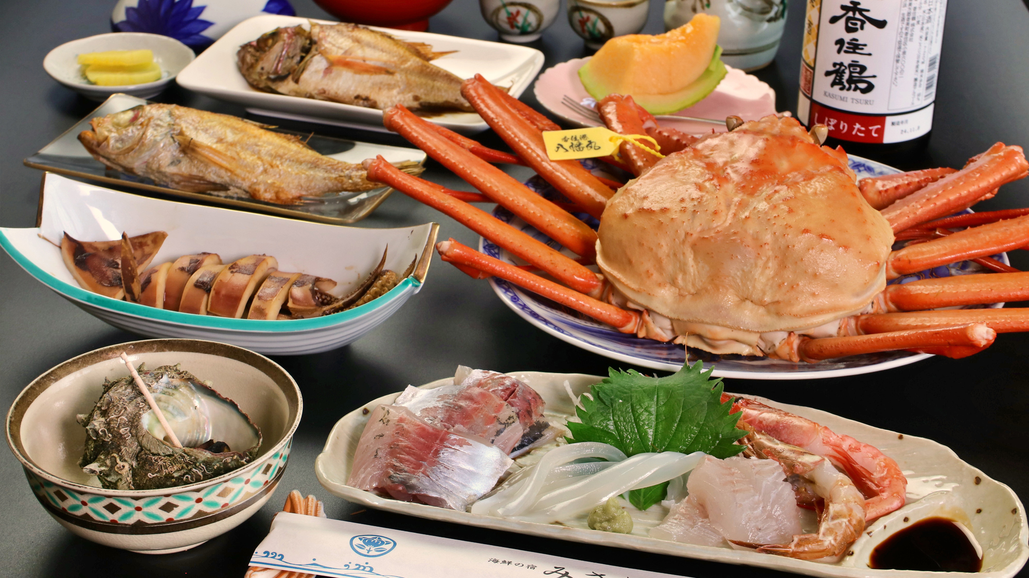 海鮮の宿 民宿みさきのカニ料理。焼きガニとカニ刺し