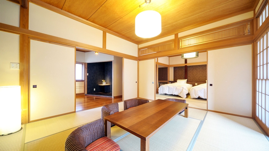 ・松の荘：和室にセミダブルベッド2台を設置