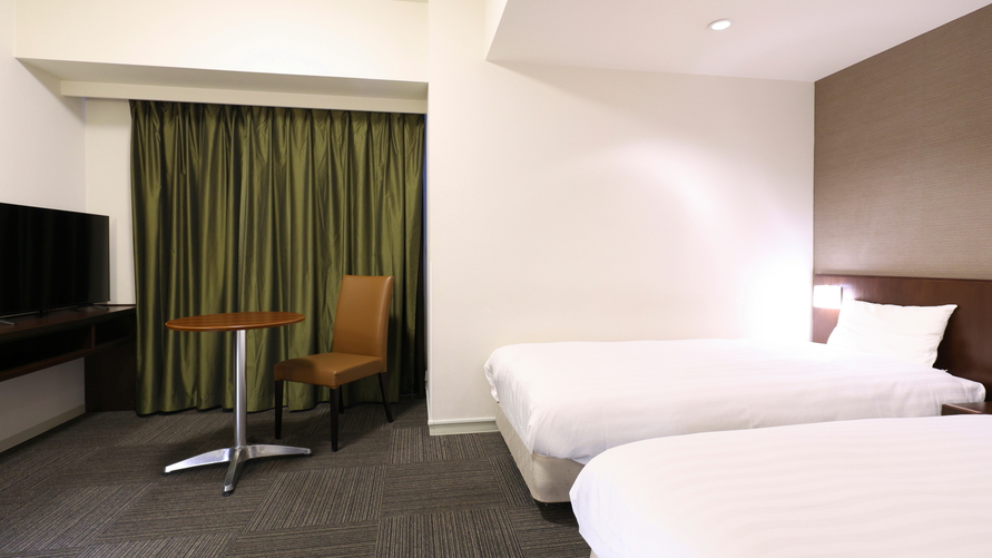 スタンダードツイン（シモンズ社製:100×205センチのシングルベッド２台）約22平米