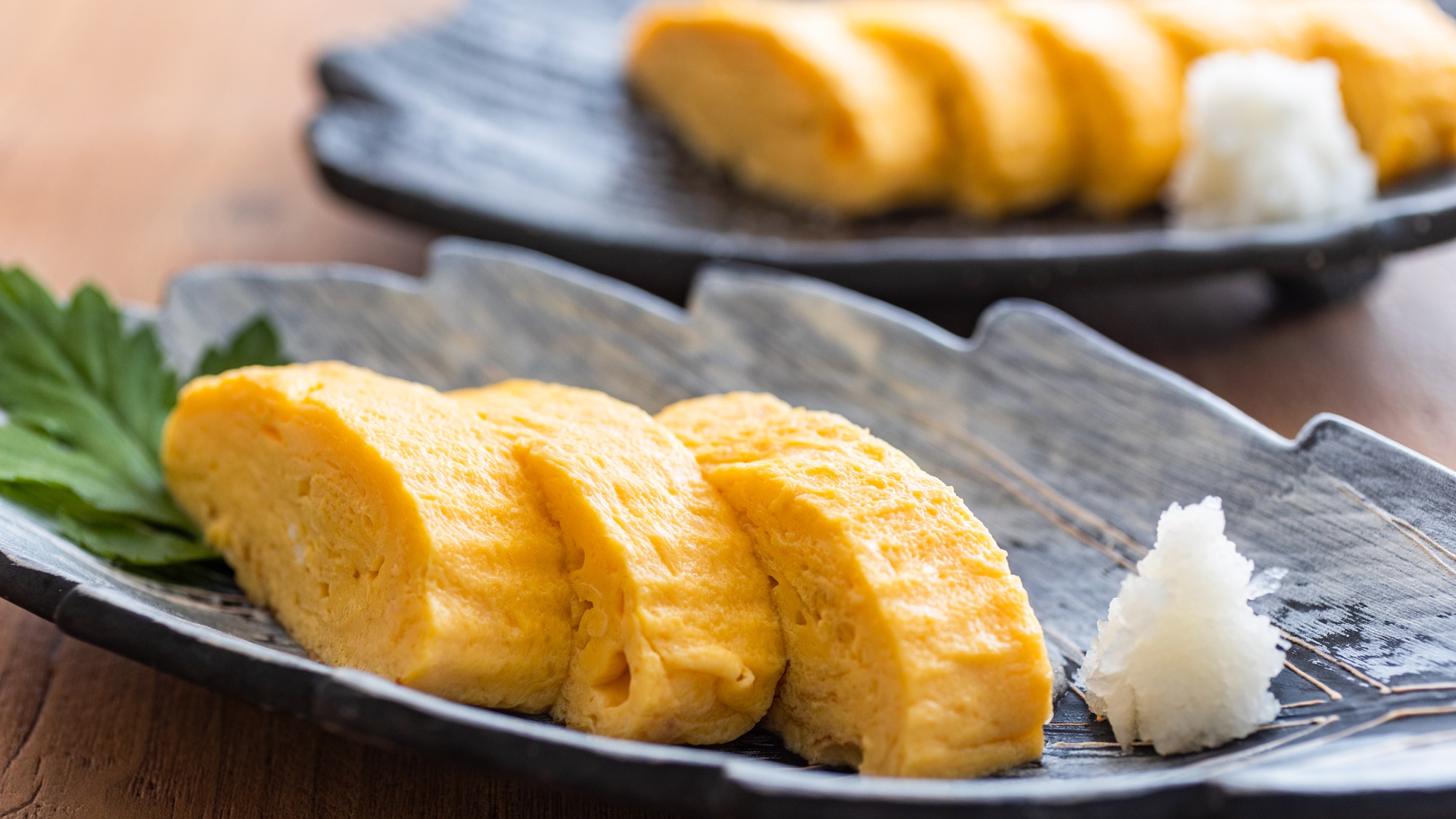 *【朝食一例】しっとりした口当たりと風味豊かな出汁の塩味のだし巻き卵は大好評です