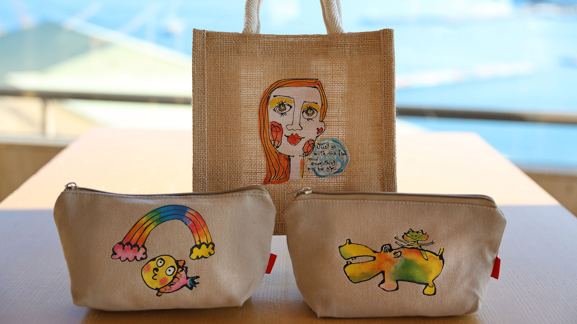 神奈川県は湯河原町在住アーティストの方の素敵なアート作品（ポーチなど各種）。3F売店で販売中です。